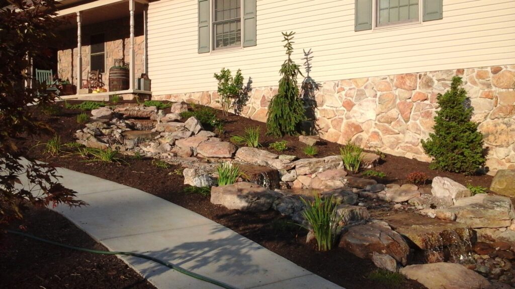 Natural rock waterfall along a garden walkway in York, PA