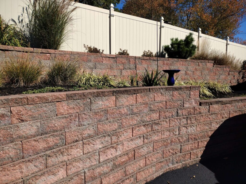 Maintained terraced garden wall with ornamental grasses in York County