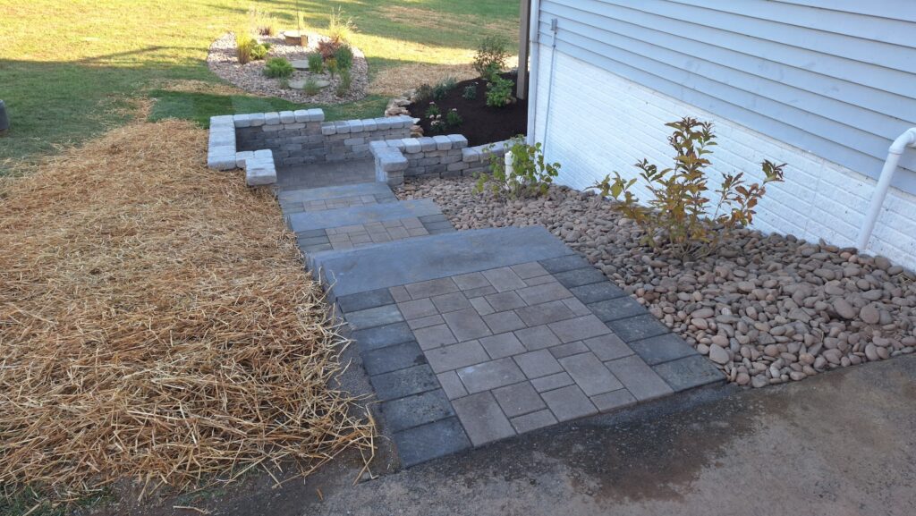 Tidy maintained walkway garden with seasonal plantings in York, PA